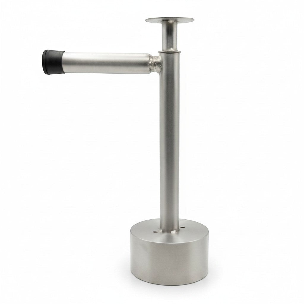 Shankra Creations steel stand for cow dung cake, 1ft tall, with a circular base and a horizontal holder with a black rubber tip.